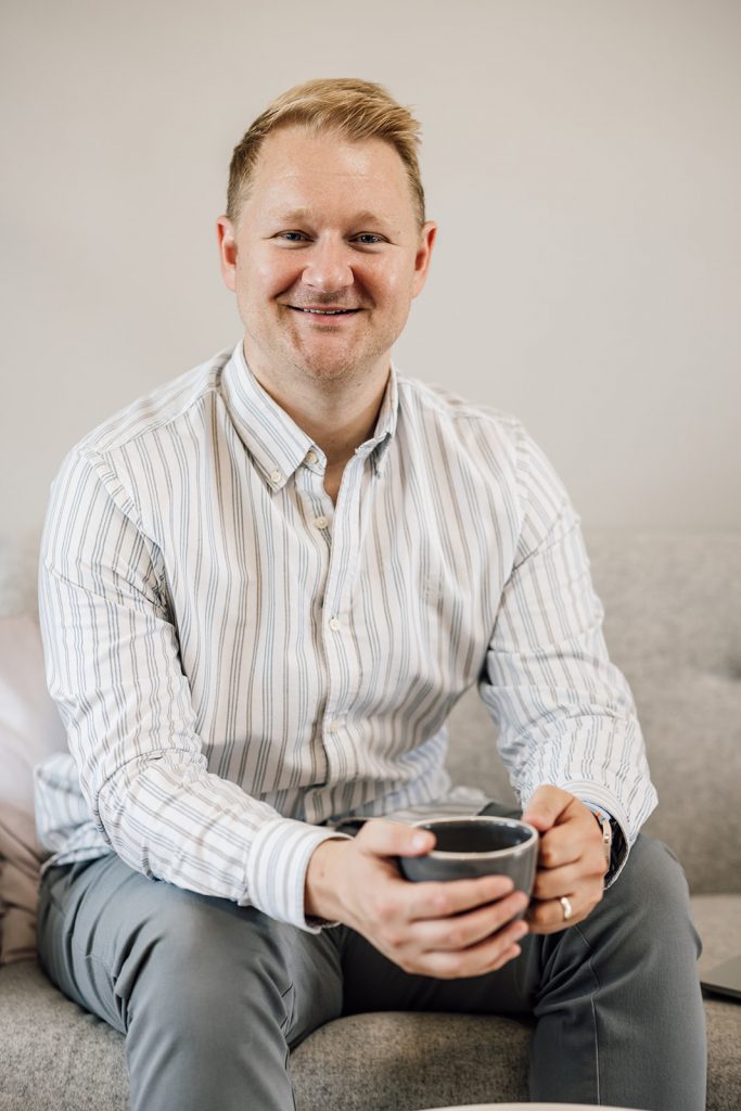 Man sitting with a coffee cup.